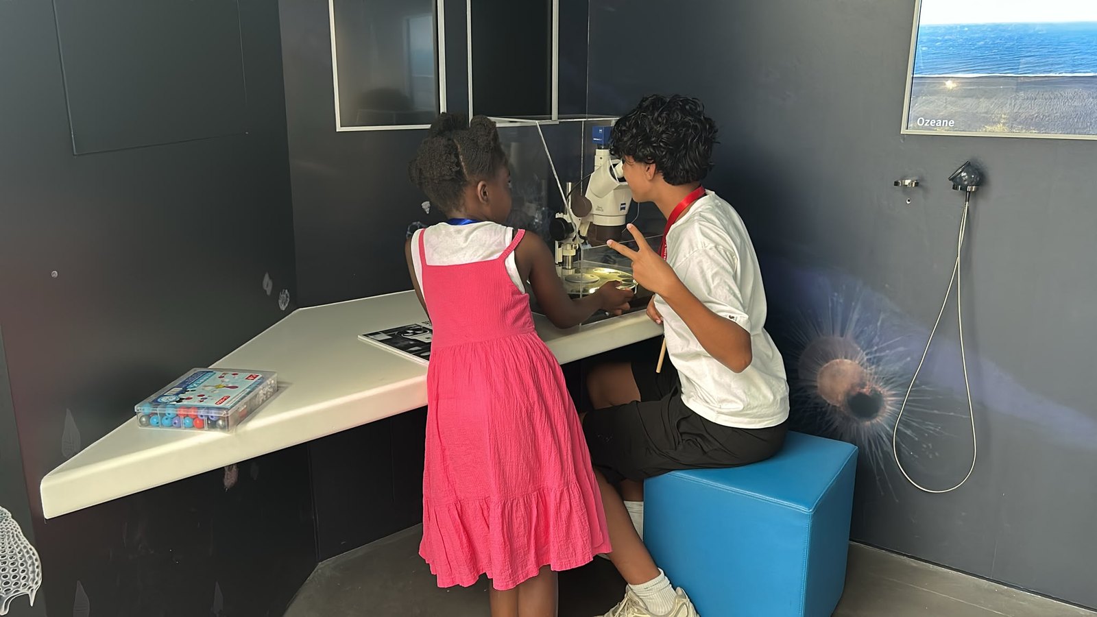 Two children at the microscope on an excursion day