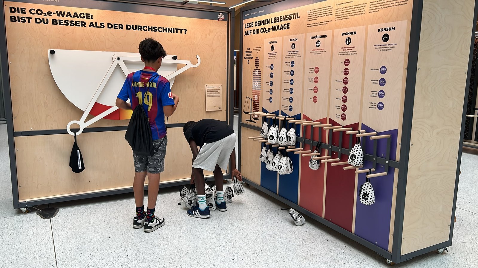 Children working through a hands-on climate exhibit