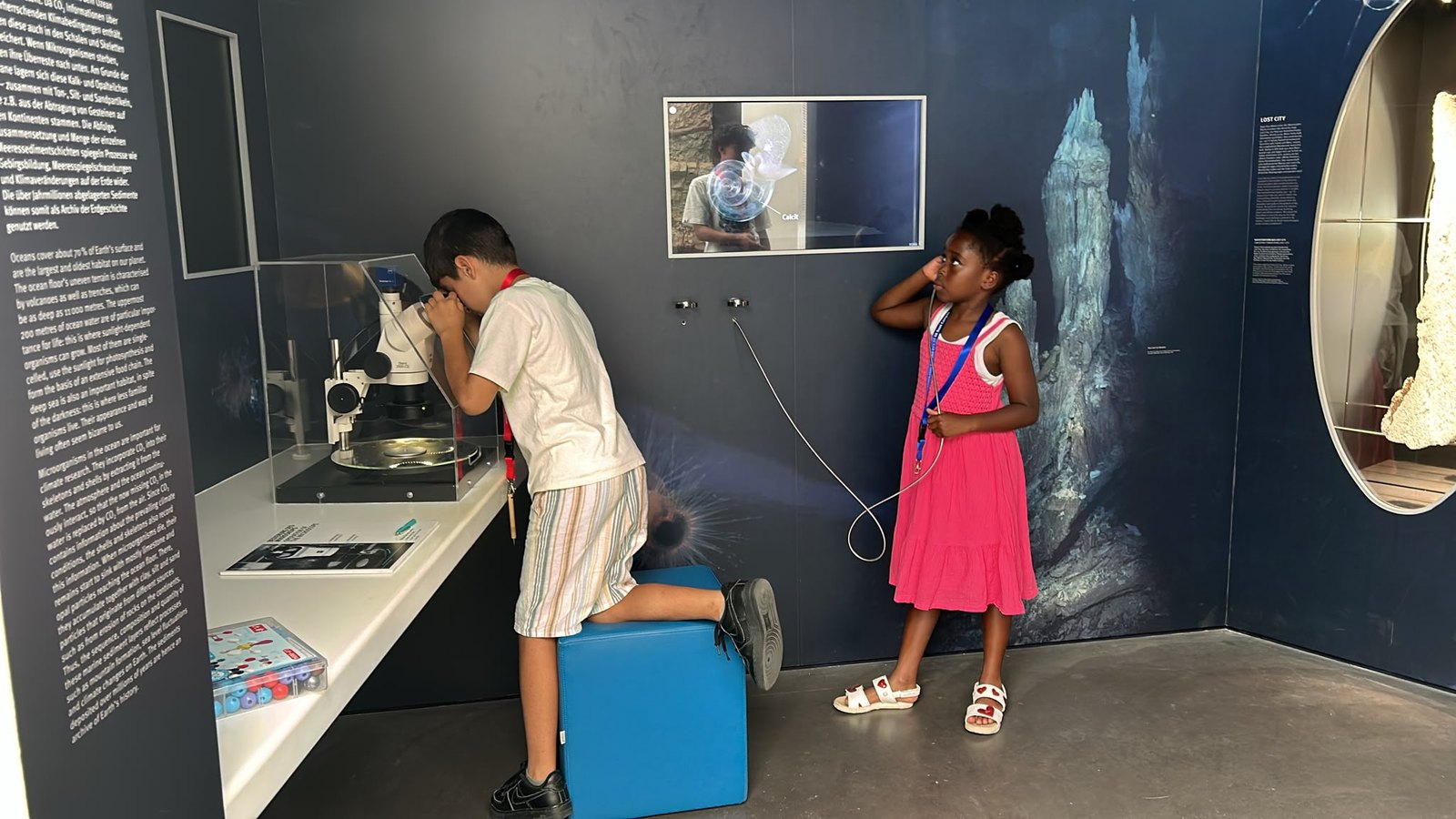 A child at the microscope during a science excursion